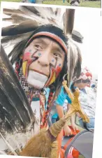  ?? (SP file photo) ?? Powwow dancer Raindrow Starchild holds an eagle-foot baton.