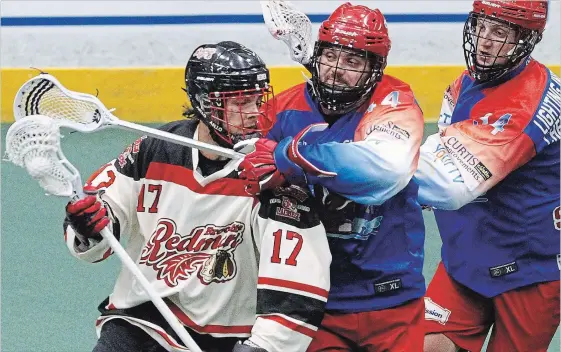  ?? CLIFFORD SKARSTEDT EXAMINER ?? Peterborou­gh Century 21 Lakers’ Chad Tutton pressures Brooklin Redmen’s Nick Chaykowsky during first period Major Series Lacrosse action on July 5 at the Memorial Centre. The Lakers and the Redmen face off in the Major Series Lacrosse semifinals...