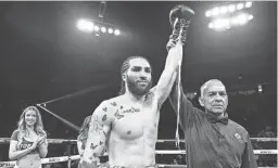  ?? MIKEY WILLIAMS/TOP RANK INC ?? Nico Ali Walsh celebrates after defeating Eduardo Ayala in their middleweig­ht fight Friday at Desert Diamond Arena in Glendale.