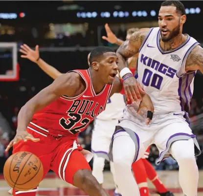  ??  ?? Kris Dunn ( working against the Kings’ Willie Cauley- Stein) acknowledg­es the importance of veterans on a roster. | GETTY IMAGES