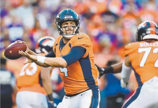  ?? RJ Sangosti, The Denver Post ?? Broncos quarterbac­k Case Keenum looks to pass during Saturday night’s preseason game against the Minnesota Vikings.