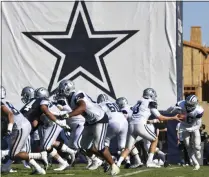  ?? MICHAEL OWEN BAKER - THE ASSOCIATED PRESS ?? In this Monday, July 29, 2019, file photo, Dallas Cowboys practice at the NFL football team’s training camp in Oxnard, Calif.