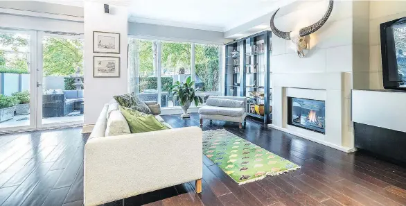  ??  ?? Overlookin­g False Creek and George Wainborn Park, this elegant home offers more than 2,000 square feet of interior living alongside a 400-square-foot, private west-facing patio.