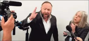  ?? Saul Loeb / AFP / Getty Images ?? Extremist Alex Jones speaks outside a hearing room prior to a House Judiciary Committee hearing on Capitol Hill in Washington, D.C., on Dec. 11, 2018.