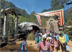  ?? SHUTTERSTO­CK ?? Pilgrims climb the trail to the holy mountain Adams Peak.