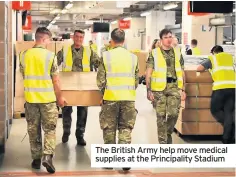  ??  ?? The British Army help move medical supplies at the Principali­ty Stadium