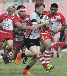  ?? Satish Kumar / The National ?? Peter Kelly, left, makes a tackle during the UAE Conference final. He would go on to score the deciding try