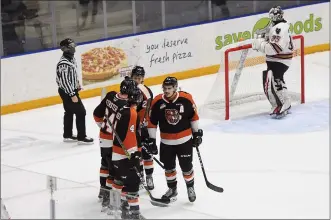  ?? NEWS PHOTO KELLEN TANIGUCHI ?? The Tigers celebrate after Corson Hopwo extends his team’s lead to 2-0 in the second period of Western Hockey League action versus the Calgary Hitmen on Friday night at Co-op Place.