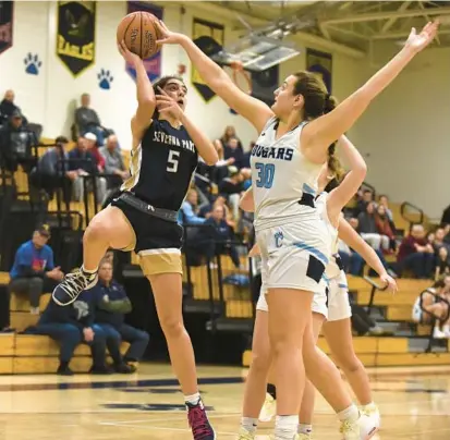  ?? PAUL W. GILLESPIE/CAPITAL GAZETTE POHOTOS ?? Severna Park’s Lilly Spilker has her shot blocked by Chesapeake’s Kasey Slade during the fourth quarter of Tuesday’s game.