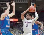  ?? STEPHEN DUNN/AP PHOTO ?? UConn’s Tarin Smith (2) goes up against Connor Bennett of UMass Lowell (35) during the game on Nov. 27 at Gampel Pavilion in Storrs.