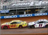  ?? (AP/Wade Payne) ?? Joey Logano (22) leads Denny Hamlin through Turn 4 during Monday’s NASCAR Cup Series race Monday in Bristol, Tenn. Logano earned his third career victory at Bristol, and Hamlin came in third behind Ricky Stenhouse Jr.