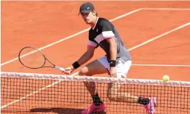  ?? ?? Alex de Minaur of Australia plays a forehand in his French Open second round match against Argentina’s Tomas Martin Etcheverry at Roland Garros in Paris. Photograph: Teresa Suárez/EPA