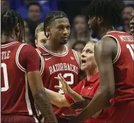  ?? ?? Eric Musselman talks with his Arkansas Razorbacks team during a timeout in the second half of an NCAA college basketball game against Kentucky on March 2 in Lexington, Ky. (AP/James Crisp)