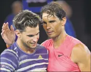  ?? Andy Brownbill / Associated Press ?? Dominic Thiem, left, is congratula­ted by Rafael Nadal after winning their quarterfin­al match at the Australian Open on Wednesday.