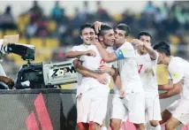  ??  ?? BORIS STREUBEL/GETTY IMAGES Allahyar Sayyad (2nd L) of Iran celebrates with teammates after scoring his team’s first goal in the 3-1 victory over Guinea at the FIFA U-17 World Cup 2017 in Goa, India, on October 7, 2017.