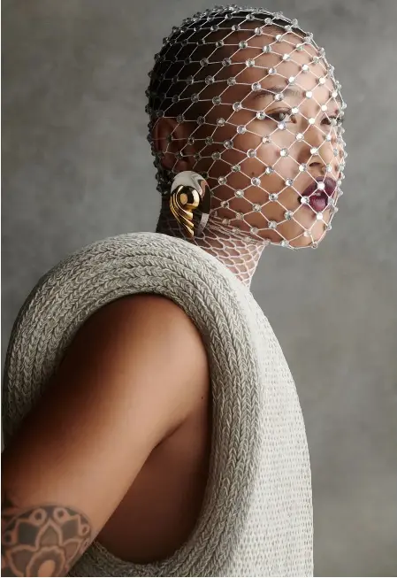  ?? ?? LOUIS VUITTON dress, RYSIA PIERZCHALA mask, vintage earrings from SUSAN CAPLAN