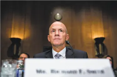  ?? Andrew Harrer / Bloomberg ?? Richard Smith, former CEO of Equifax, told committee members in Washington on Wednesday that the credit bureau is offering “five free services” for one year and by Jan. 31 will offer a free lifetime “lock.”