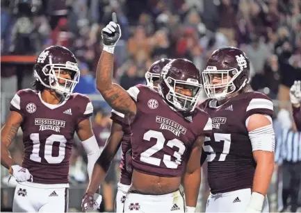  ?? ROGELIO V. SOLIS/AP ?? Mississipp­i State running back Dillon Johnson (23) celebrates a 9-yard touchdown run against Kentucky during the first half Oct. 29 in Starkville, Miss.