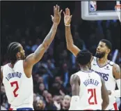  ?? Associated Press ?? TEAMWORK TheClipper­s’ Paul George, right, and teammate Kawhi Leonard (2) are healthy at the same time to start the 2020-21 season, and that’s given the Clippers a renewed sense of optimism.