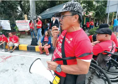  ??  ?? RETIRED SPO4 Hendrick Dacoyan (on wheelchair), leads the rally to appeal to senators, especially Ronald dela Rosa and Panfilo Lacson, for an increase in the pension of retired police officers with total permanent physical disability and their survivors, and the families of police personnel killed in action who were not covered by the pension increase. The rally was held in front of the Senate in Pasay City. PNA photo