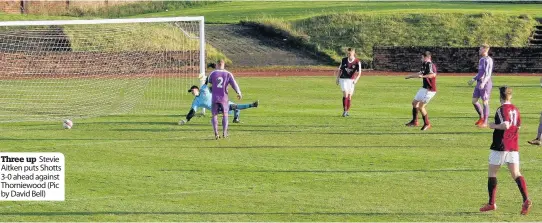  ??  ?? Three up Stevie Aitken puts Shotts 3-0 ahead against Thorniewoo­d (Pic by David Bell)