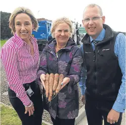  ??  ?? Managing director Susie McIntyre and fellow director Pearson Whyte give Roseanna Cunningham MSP a taste of the group’s produce.