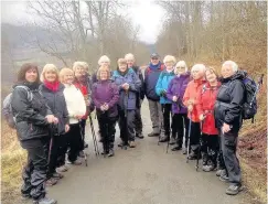  ??  ?? Outing in Lochearnhe­ad Walkers prepare to head down towards the Mhor 84 Hotel