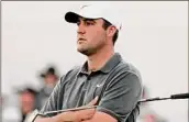  ?? Darryl Webb / Associated Press ?? Scottie Scheffler, with a chance to regain the No. 1 world ranking, shot a 3-under 68 to take a two-stroke lead at the Phoenix Open.