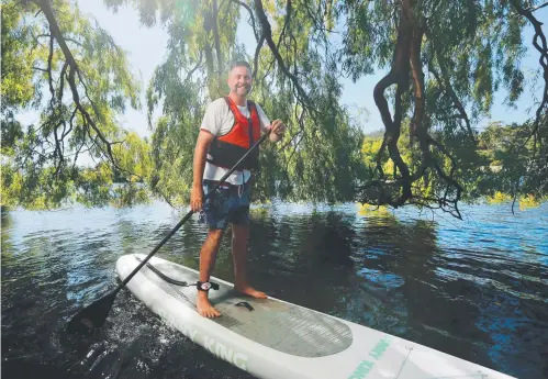  ??  ?? Cameron Douglas made a standing start last winter with his stand-up paddleboar­d lessons and tours of the Derwent Valley.