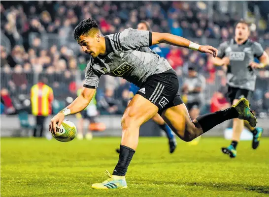  ?? Photo / Photosport ?? Rieko Ioane scores one of his hat-trick of tries in Christchur­ch last night.