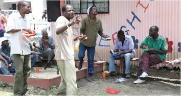  ??  ?? Homeless people enjoy a meal supplied by One Church Ministries in Avondale, Harare, on Christmas Day. by Justin Mutenda) - (Picture