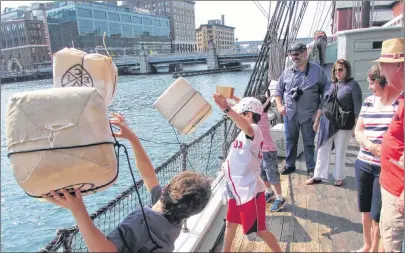  ?? JOHN NOWLAN PHOTO ?? Tossing Tea Overboard into Boston Harbour