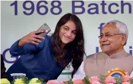  ?? — PTI ?? A student takes a selfie with Bihar Chief Minister Nitish Kumar during the alumni meet function 2018 of NIT Patna, in Patna on Sunday.