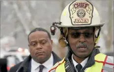  ?? Matt Freed/Post-Gazette ?? Pittsburgh Fire Chief Darryl Jones talks to reporters at the scene as Mayor Ed Gainey listens. Both were at the bridge site early that morning.