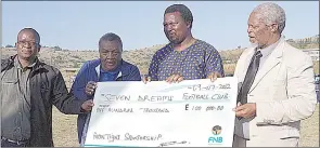  ?? (Pic: Machawe Fakudze) ?? Montigy representa­tive and EFA Vice President Mashumi Shongwe, Tibiyo TakaNgwane Managing Director, Themba Dlamini, Seven Dreams MD Bishop Bhekibandl­a Vilakati and League of Churches President Bishop Samson Hlatjwako posing with the replica cheque.