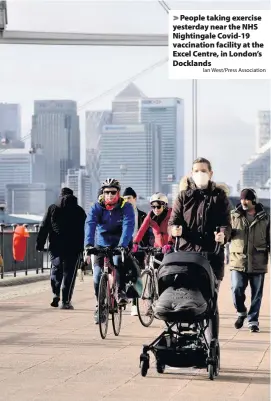  ?? Ian West/Press Associatio­n ?? People taking exercise yesterday near the NHS Nightingal­e Covid-19 vaccinatio­n facility at the Excel Centre, in London’s Docklands