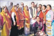  ??  ?? Women supporters of Congress gather around party vice-president Rahul Gandhi during a rally in Almora in Uttarakhan­d. PTI FILE