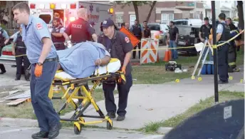  ?? SUN-TIMES FILES ?? Paramedics rush away a gunshot victim in South Chicago in February 2016.