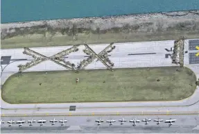  ?? BRIAN KERSEY/AP ?? Meigs Field’s location along the Chicago lakefront added to challenges. The airport closed in 2003.