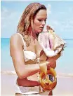  ??  ?? Unforgetta­ble: Andress wore the bikini in an iconic Dr. No scene