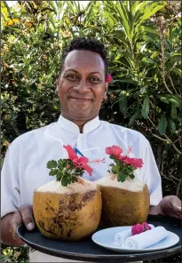  ?? Colorworld/TNS/STEVE HAGGERTY ?? When they arrive at the resort on Fiji’s Taveuni Island, Tides Reach guests are greeted with Fiji’s signature drink: fresh coconut water.