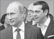  ?? Alexander Zemlianich­enko Associated Press ?? RUSSIAN President Vladimir Putin, left, and Greek PrimeMinis­ter Alexis Tsipras arrive Friday for the St. Petersburg Internatio­nal Economic Forum.