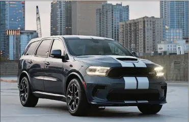  ?? PHOTO
DODGE ?? 2021 Dodge Durango SRT Hellcat: The most powerful SUV ever features a new aggressive exterior, a new interior with a driver-centric cockpit and delivers 710 horsepower, shown here in Reactor Blue with Dual Silver stripes.