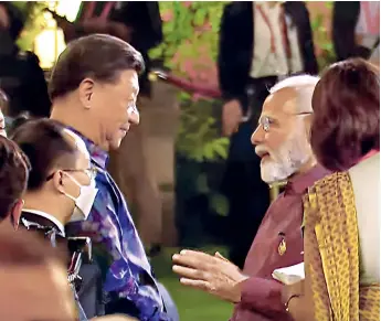  ?? ANI ?? WHEN ADVERSARIE­S MET
PM Narendra Modi with Xi Jinping at the G20 dinner in Bali, Nov. 15, 2022
