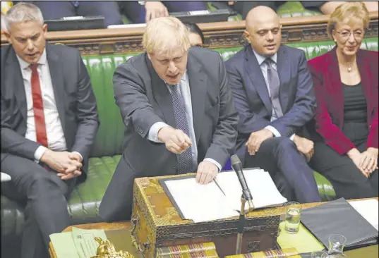  ?? House of Commons ?? British Prime Minister Boris Johnson speaks to lawmakers inside the House of Commons in London on Saturday about the details of his new Brexit deal with the European Union. “Further delay would be bad for this country,” the prime minister said.