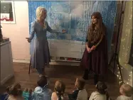  ?? KEVIN MARTIN — THE MORNING JOURNAL ?? Sisters Lizzie Traxler and Meredith Traxler entertain youngsters at a Frozen meet and greet at What the Cupcakes in Avon at 36795 Detroit Road.