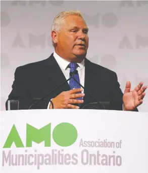  ?? JEAN LEVAC / POSTMEDIA NEWS ?? Premier Doug Ford told the Associatio­n of Municipali­ties of Ontario on Monday that
municipali­ties will have to shoulder more of the cost of health and child care.