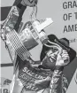  ?? Mirco Lazzari / Bongarts/Getty Images ?? Alex Rins gives his trophy a test ride as he celebrates winning the Grand Prix of the Americas MotoGP race at Austin.