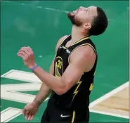  ?? MICHAEL DWYER — THE ASSOCIATED PRESS ?? Golden State Warriors guard Stephen Curry (30) reacts during the fourth quarter of Game 4of basketball’s NBA Finals against the Boston Celtics, Friday in Boston.