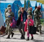  ?? ?? Civilians from Mariupol at a camp in Donetsk